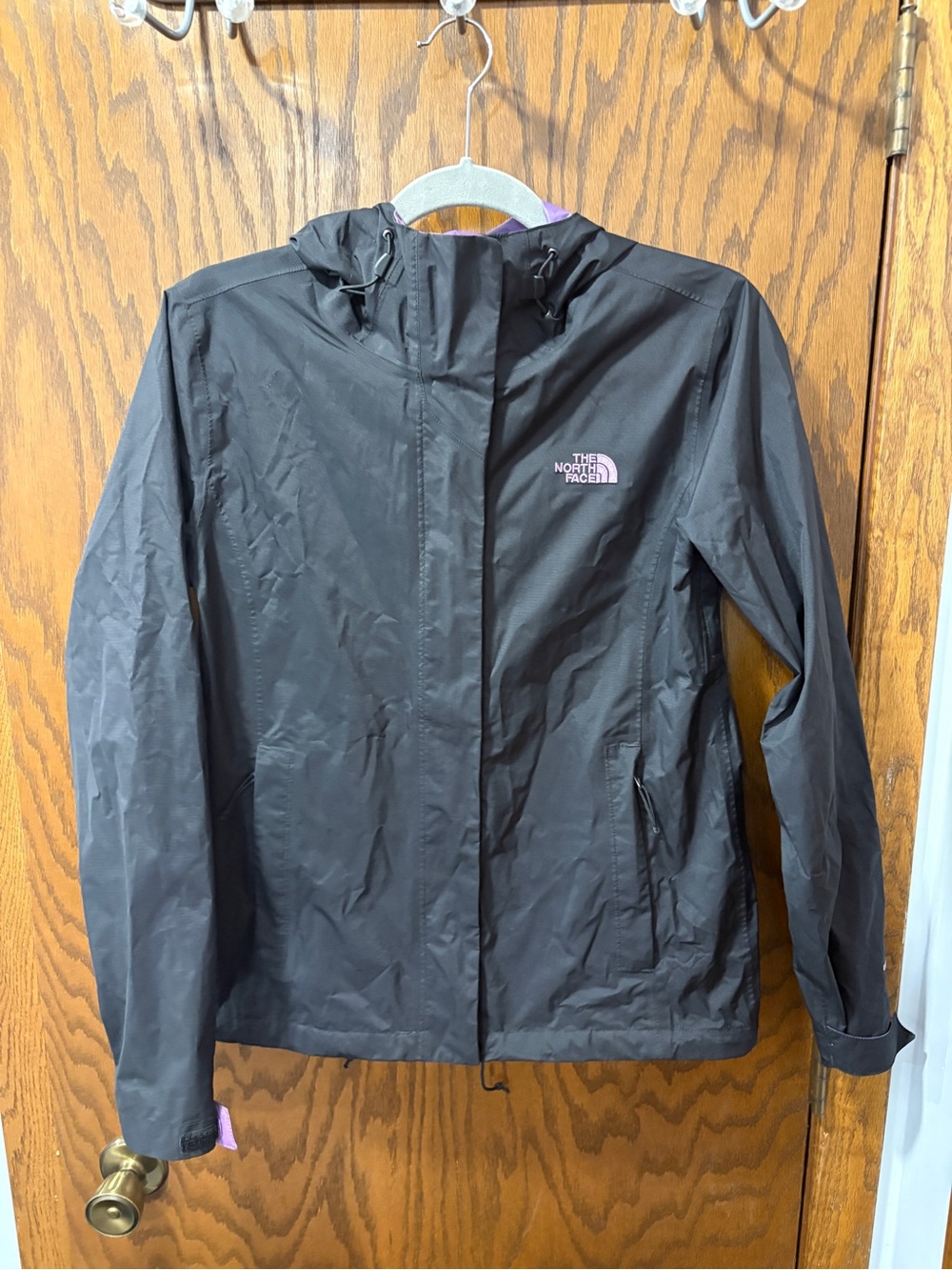 The North Face Women's Black Hooded Rain Jacket with Purple Logo Accent
